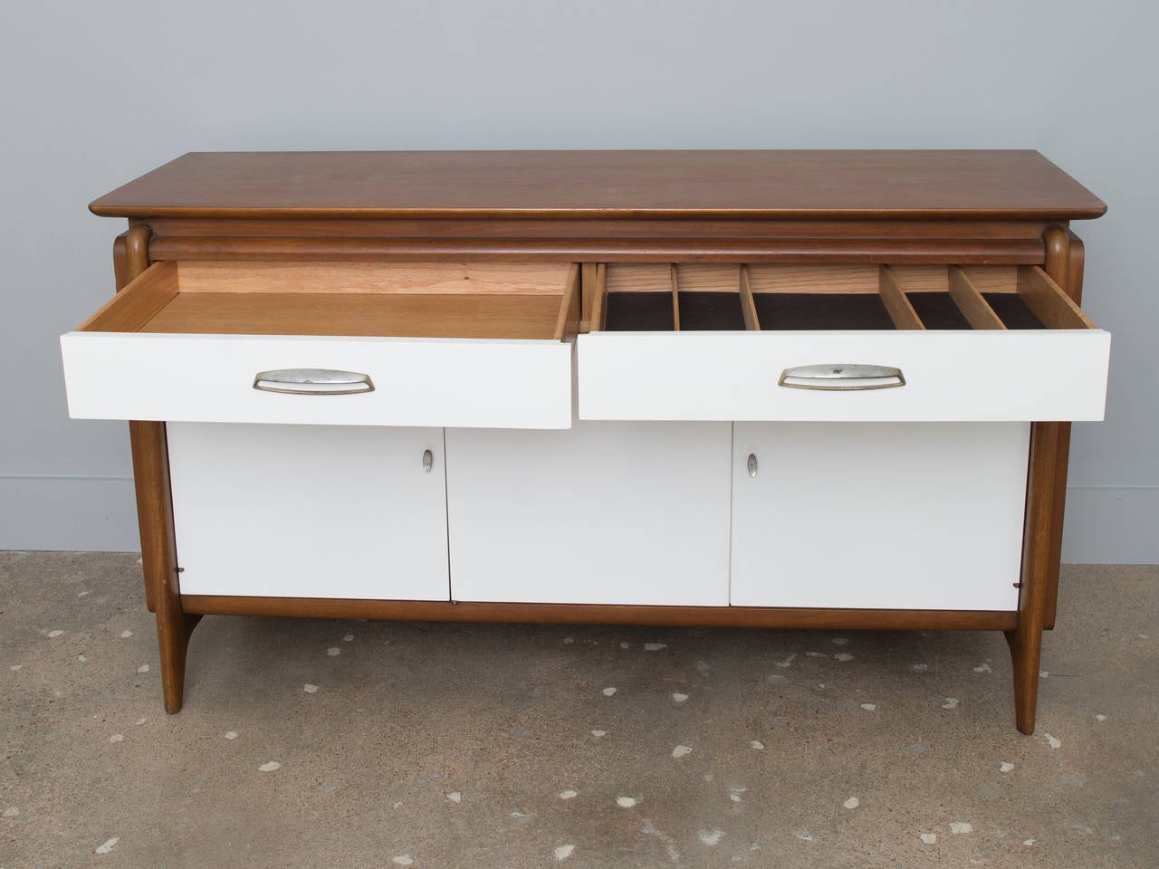 Quality vintage American-made 2-drawer 3-door credenza with dovetailed drawers.  Made by Drexel and part of their Projection Collection.  Perfect for a small dining area, hallway, kid's room or family room as an entertainment unit.