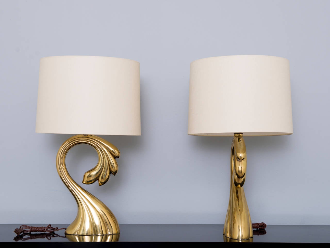 Pair of vintage sculptural lamps by Pierre Cardin with the signature wavy P in the brass base.