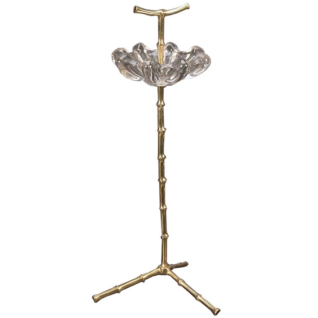 A brass Stand by Maison Baguès with a crystal dish and faux bamboo body on a tripod base.