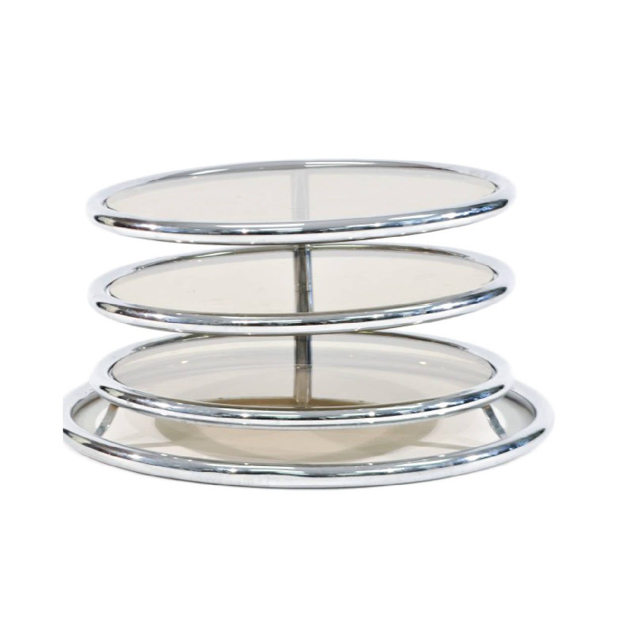 Three-tiered stackable coffee table from Italy. Extends and opens to expose three round table tops of smoked glass. Frame is made of chrome tubing.
