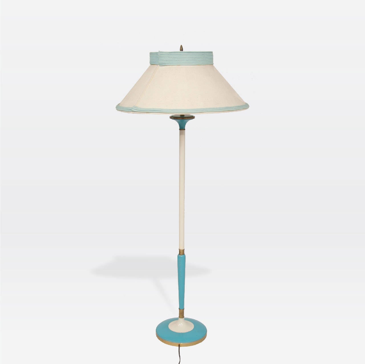 Blue and white enameled metal floor lamp. Original shade is linen with blue fabric piping over white milk glass.