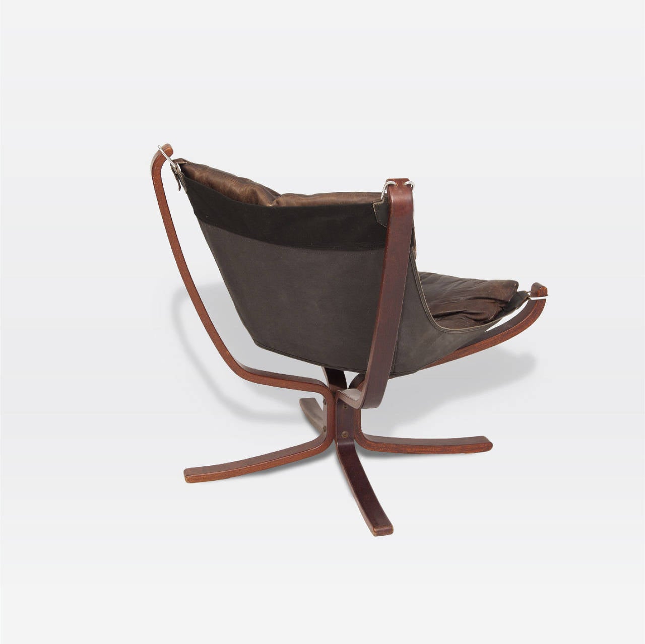 Sigurd Ressell for Vatne Mobler chair with tufted leather. Sling seat supported by tan canvas and chrome hardware. X-form rosewood frames.