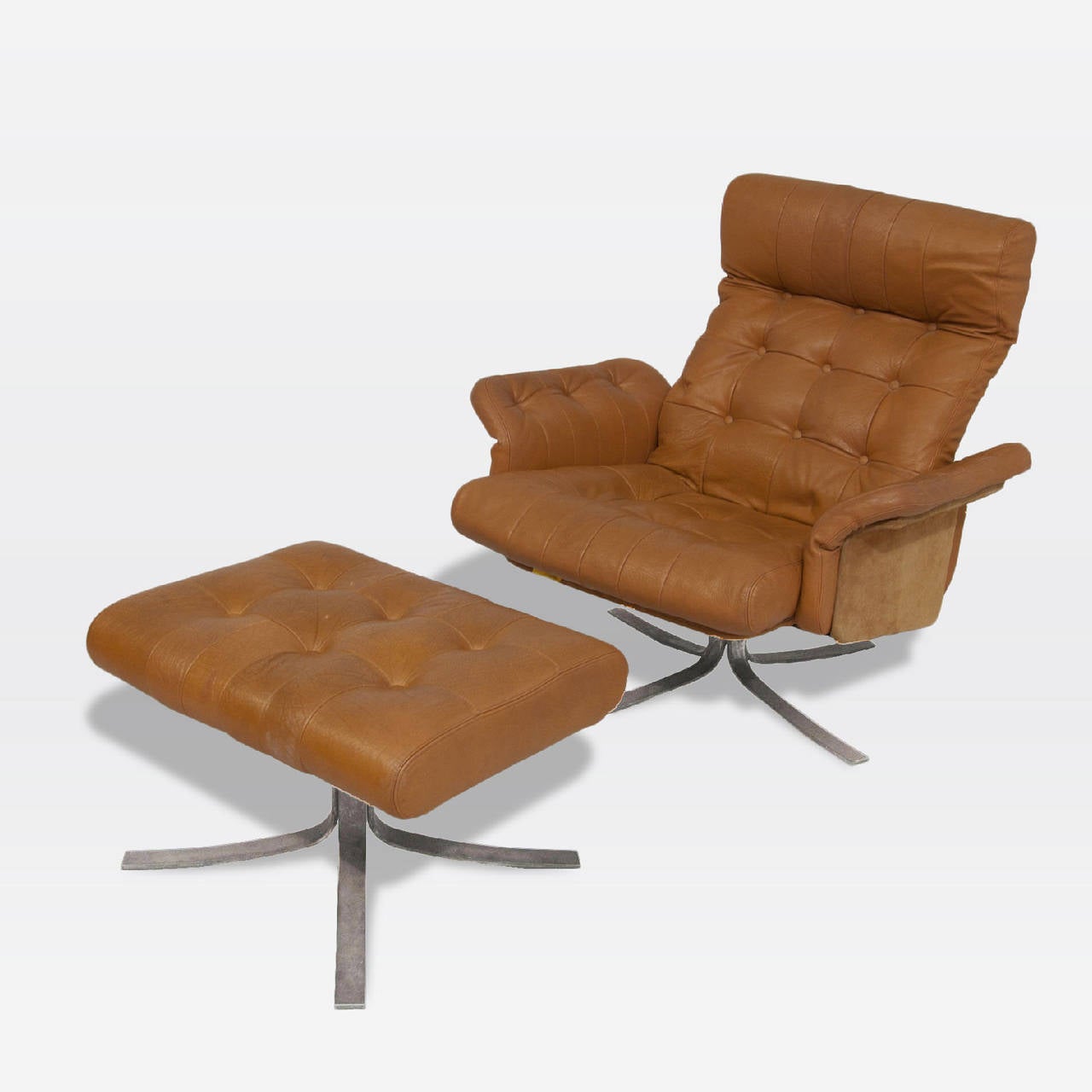 Brown tufted leather lounge and ottoman designed by Søren Nissen and Ebbe Gehl, model Atlantis. Produced by Jeki Møbler. Newly upholstered in a brown supple leather with original suede supports.
