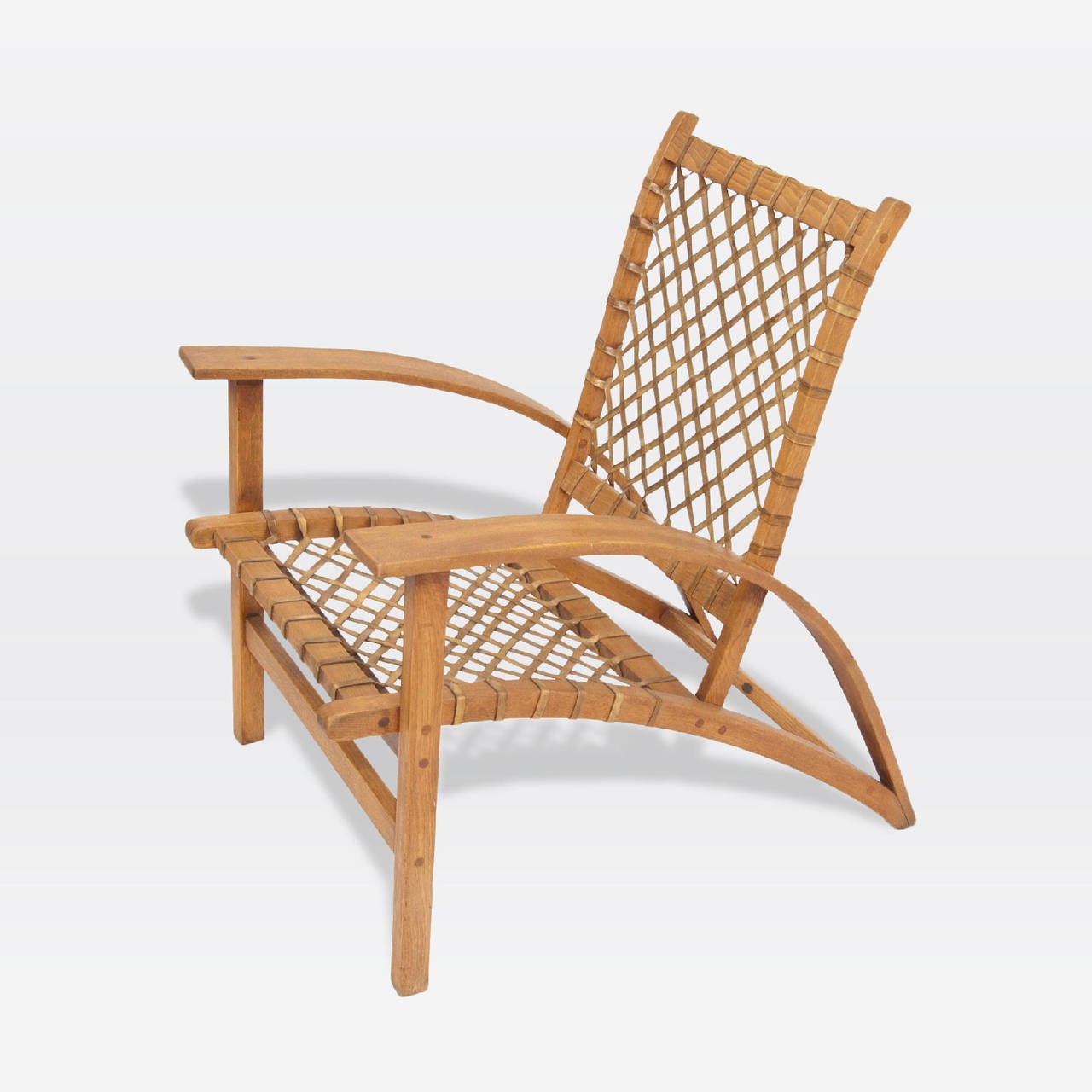 Armchair by Vermont Tubbs with wood frame, rawhide seat and back. Original label underneath.