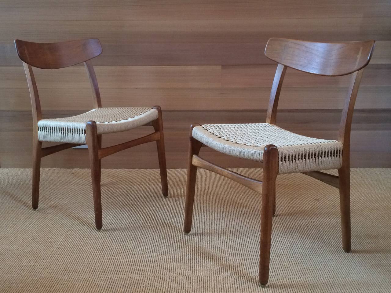 Hans Wegner side chairs manufactured by Carl Hansen and Son, model CH-23.
Oak frame, birch inlay (on chair backs) and paper cord seats.
Note: paper cord seats have been newly replaced to match manufacturers standards.
Denmark, circa 1950.