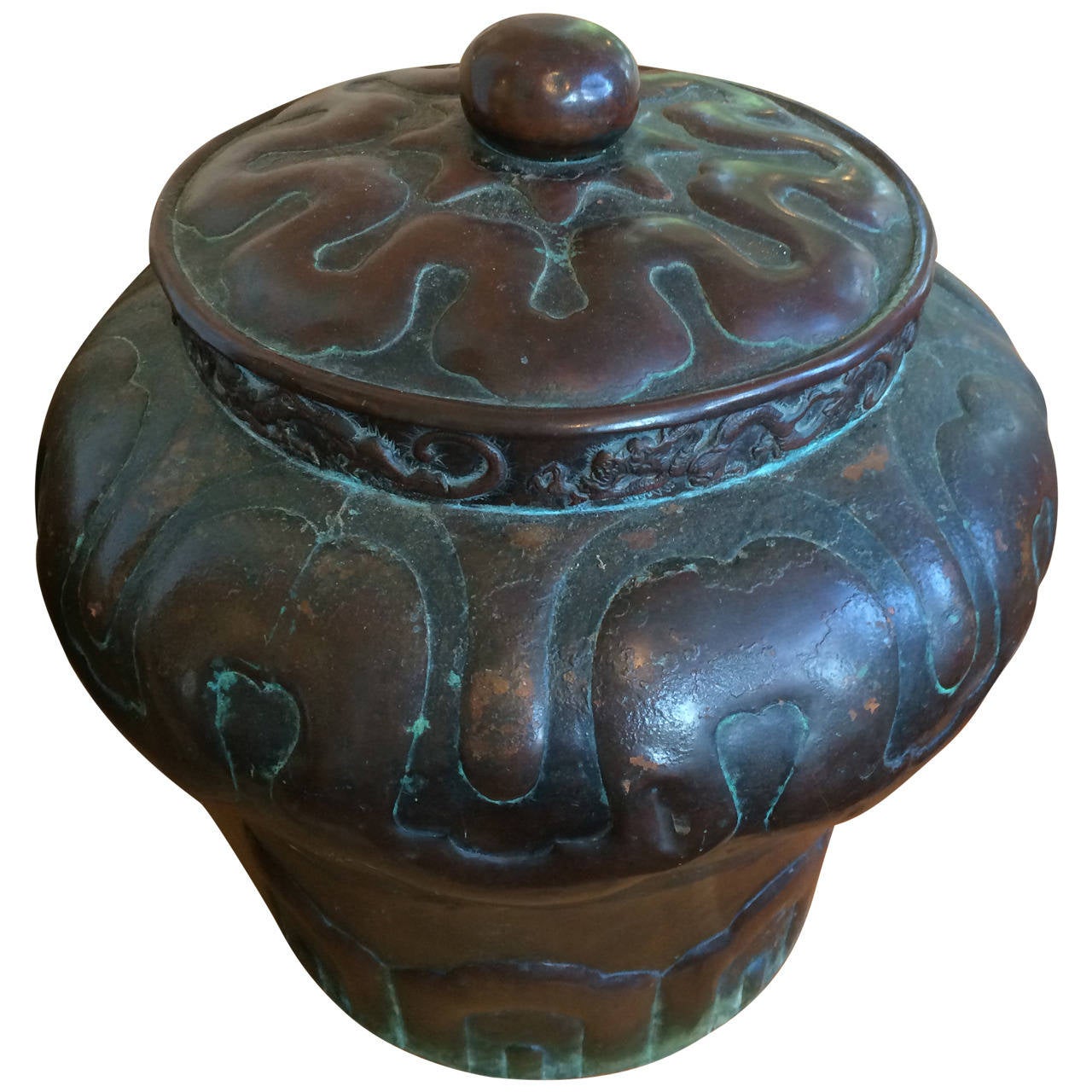 Early 20th century sculptural Chinese copper lidded jar with dragon and lotus motif.