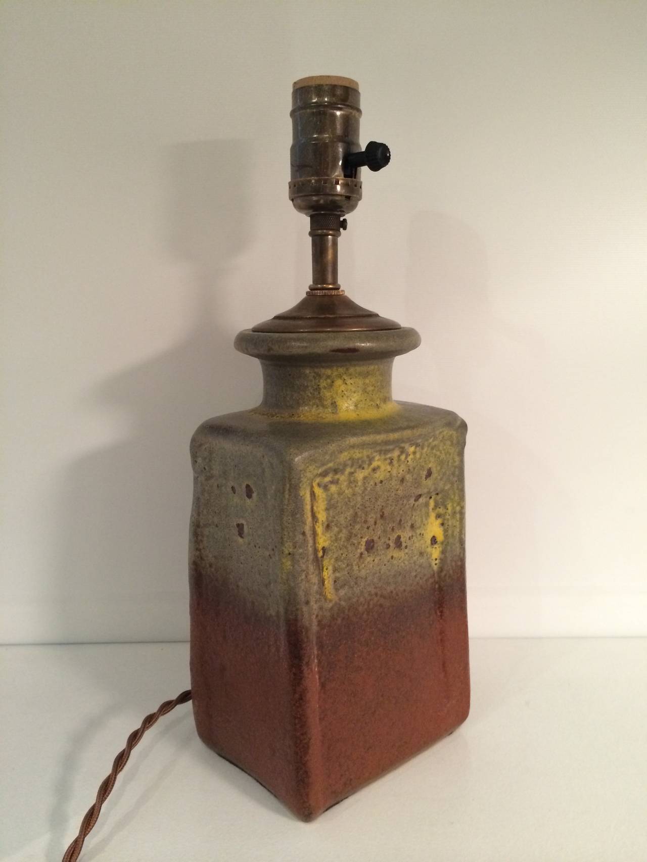 A beautifully glazed petit West German Pottery vase (in yellow, brown and grey) newly mounted as a lamp with brown silk twist cord.

Dimensions: 14