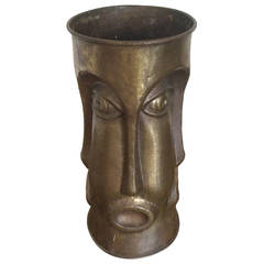 Italian Brass Umbrella Stand with Repeating Face Motif, 1960's.