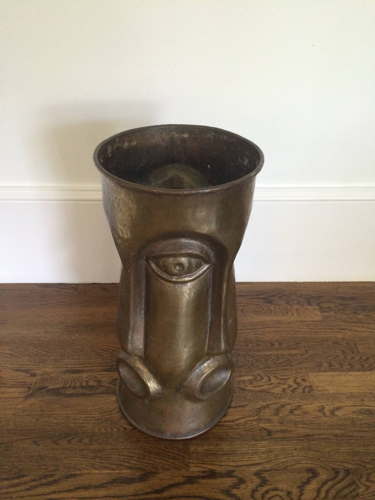 Italian Brass Umbrella Stand with Repeating Face Motif, 1960's. In Excellent Condition In Southampton, NY