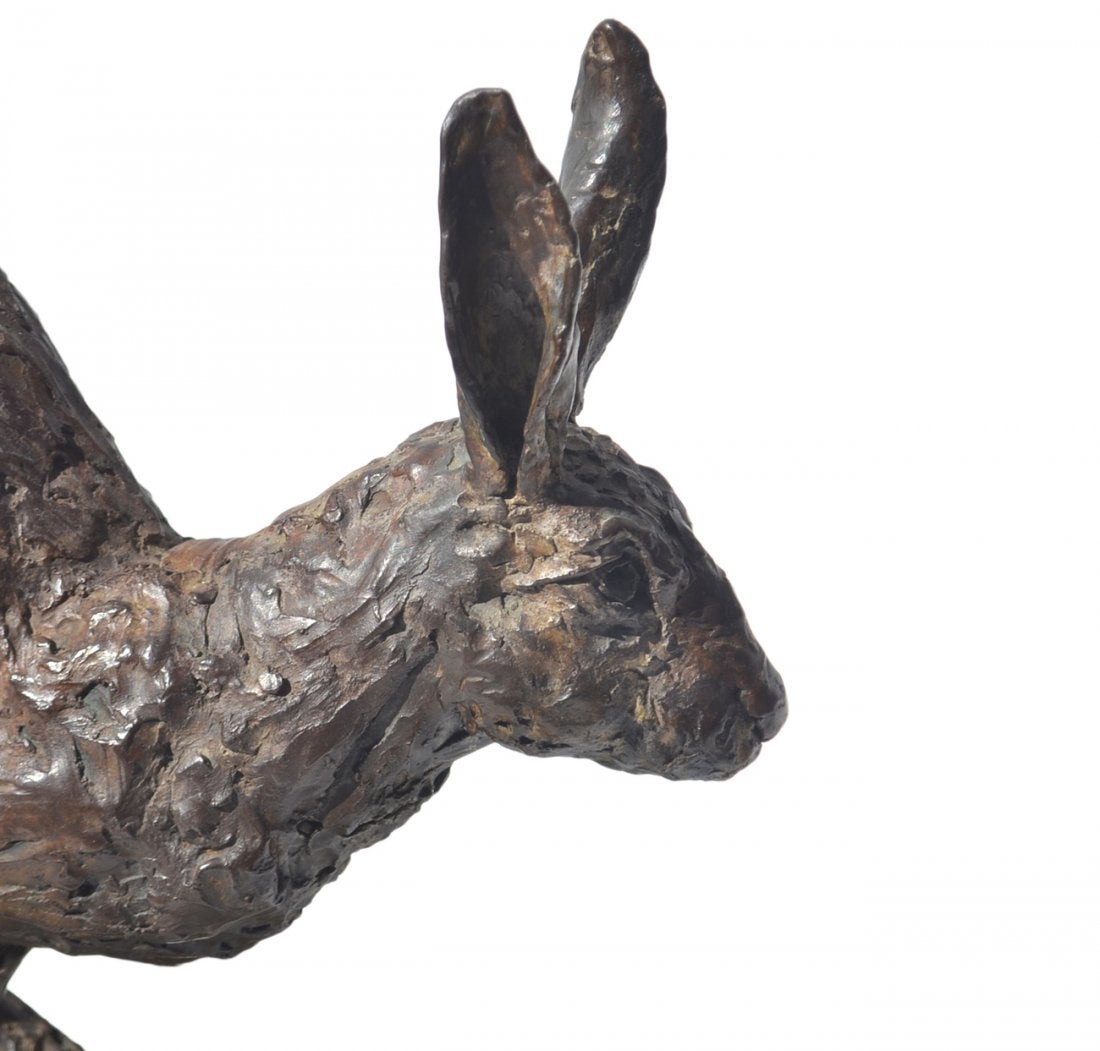 Large bronze sculpture of a hare in motion, signed and dated (1998) by the artist, Hamish Mackie. Marked 5 from an edition of 12.

Hamish’s style is unique; his work captures the inner core, strength, and grace of the subject. His sculptures are