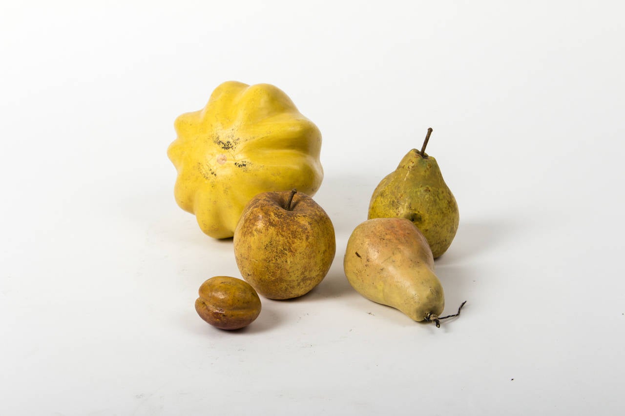 painted papermache with wax coat, comprising a peach model (handwritten number 1), two pears (one with hole on bottom, both with candle wick stems), an apple (handwritten number 47, candle wick stem), and a yellow pumpkin.
19th century, no