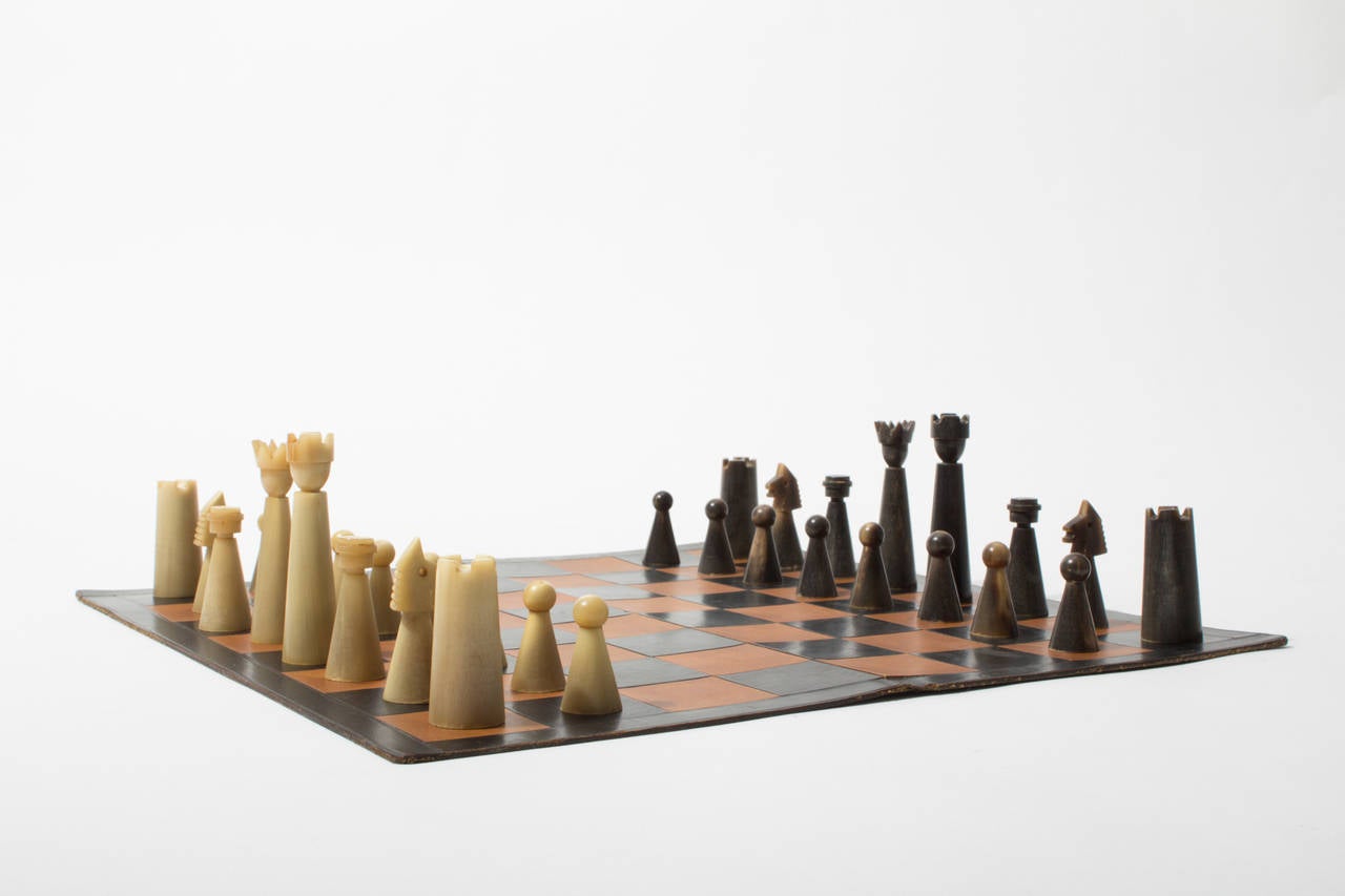 The presented chess seems to be the earliest version of the workshops chess boards. The carefully carved pieces are stunning by their simple and modernist expression. Each is expertly worked from one massive piece of cow horn.

All 32 chessmen are
