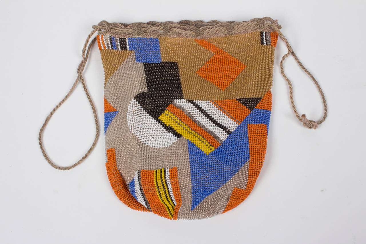 Viennese evening bag made by the Wiener Werkstatte circa 1925 this 
drawstring beaded evening bag is covered by colored glass beads. Design 
probably by Mathilde Flögl. 

We thank the Museum of Applied Arts in Vienna (MAK) for the support in
