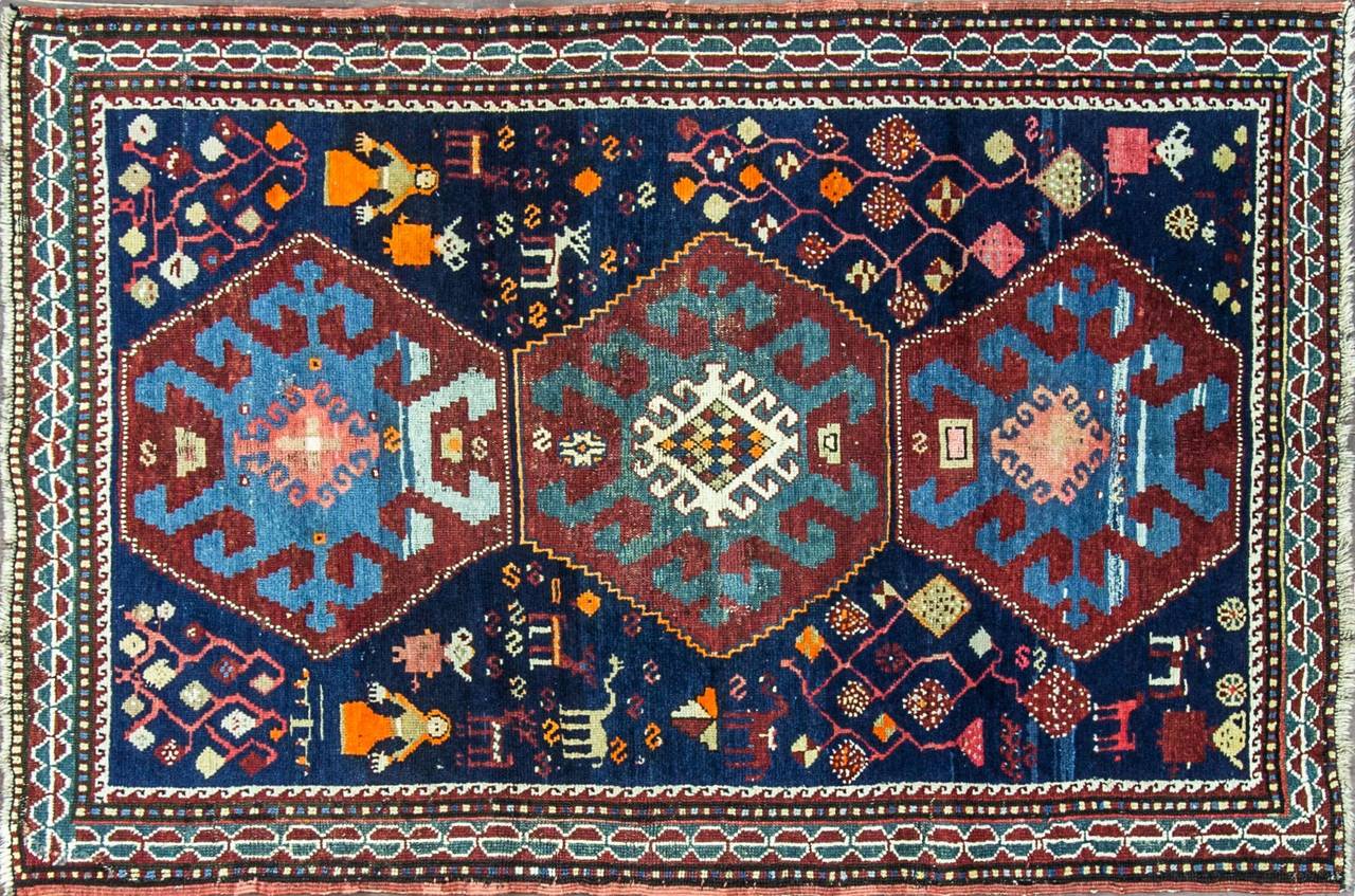 Kazak Caucasian rug:
Beautiful motives, peoples, imaginary and real animals, home goods and garden design.
Three geometric medallions.
Material are wool on wool with vegetable dyes.
Loose weave constructed as all the same period Kazak rugs.