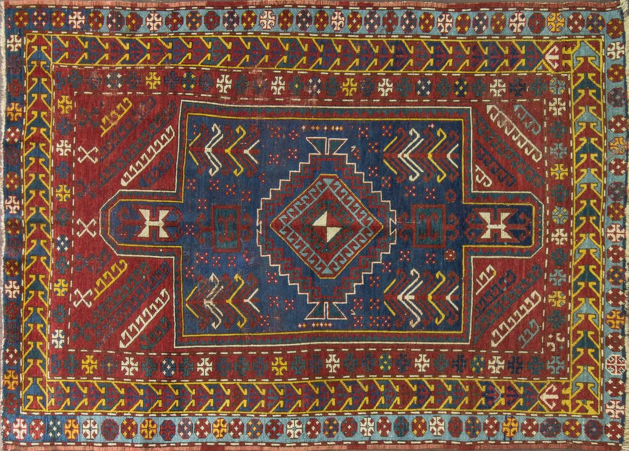 Kazak rugs are primarily produced as village productions rather than city pieces. Made from materials particular to individual tribal provinces and the rugs of the Caucasus normally display bold geometric designs in primary colors. Kazak rugs are a