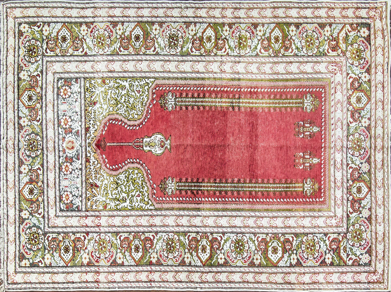 Antique silk Turkish rug, Turkey, early 20th century. This outstanding silk Turkish rug reflects incredible care and attention to fine detail in its design and composition. Red, brilliant green, yellow, ivory colors permeate the visual imagery