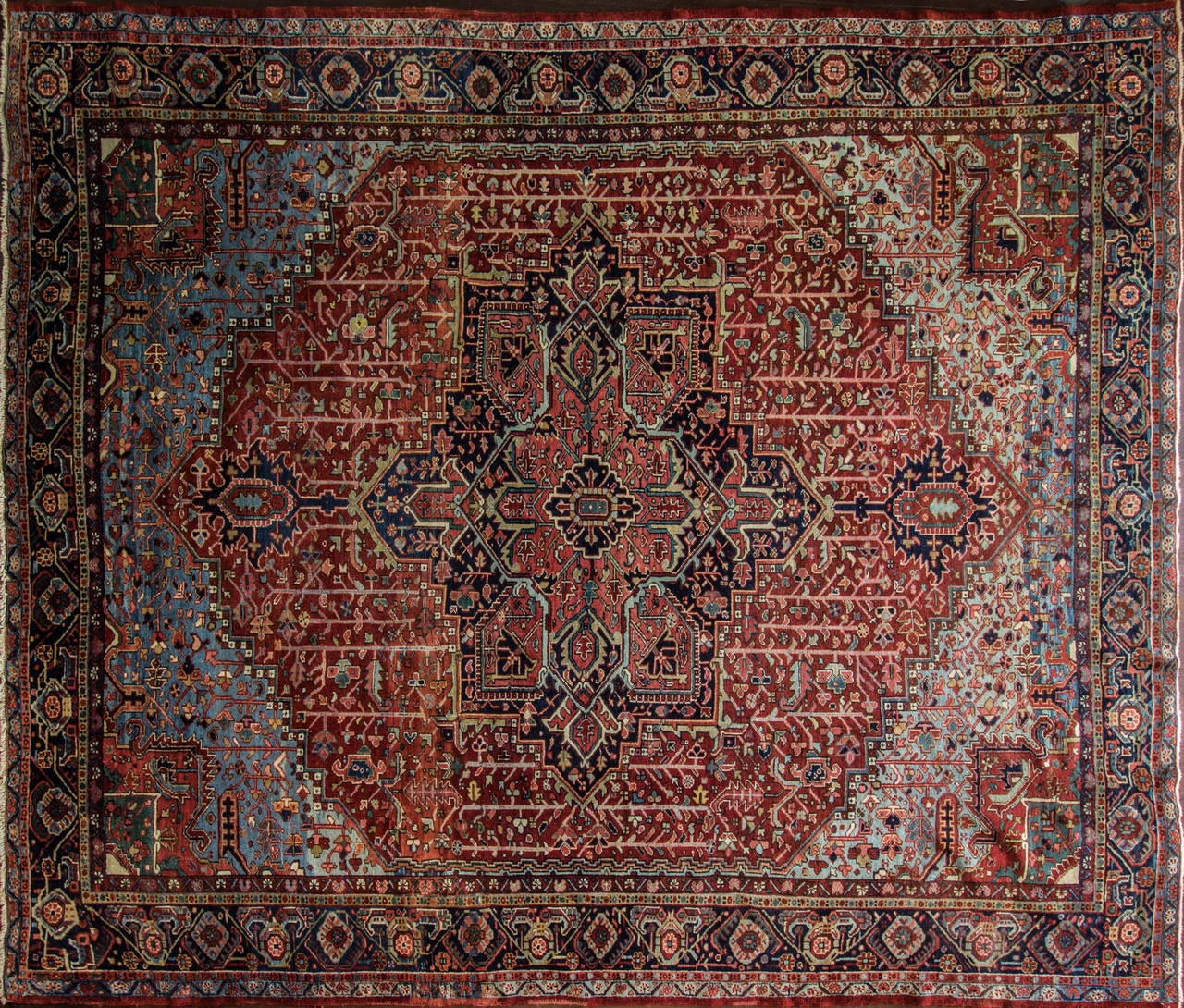 Natural wool dues, the multi colors are amazingly beautiful, mostly like antique Serapi. Charming all over design with geometric motives with unusual large medallion and size. Heriz rugs are Persian rugs from the area of Heris, East Azerbaijan in