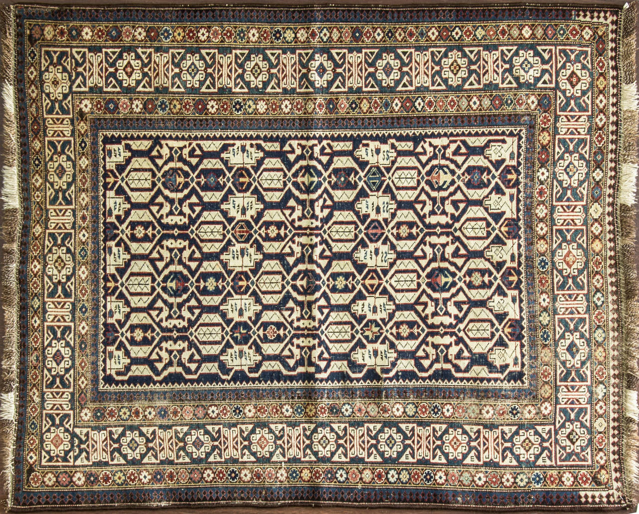 Antique Kuba (Quba is a historic Khanate or administrative district populated by the Lezghi people and Azeri Turks. Located in present-day Azerbaijan) Konaghkend Rug south Caucasus, 19th century, a geometricized white arabesque all-over field on a