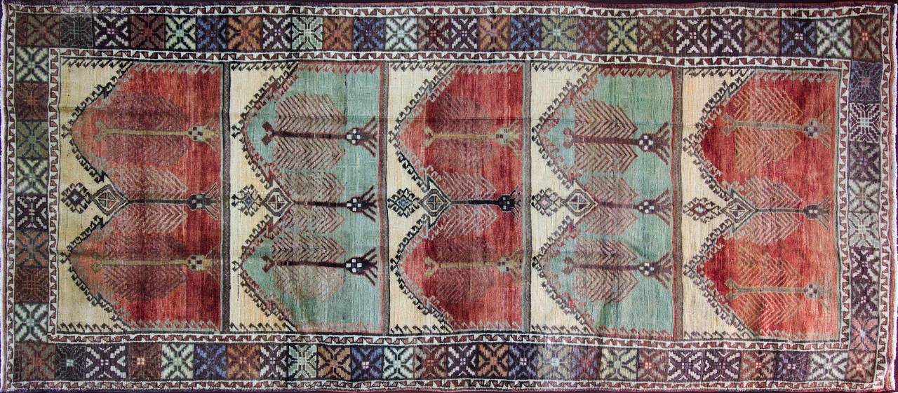 Charming muted colors Oushak carpet with the unidirectional shapes. 
Ushak rugs have been in production since the 15th century with superb wools and natural dyes. Unlike other Turkish rugs, Ushak rugs influenced after Persian rugs and they woven