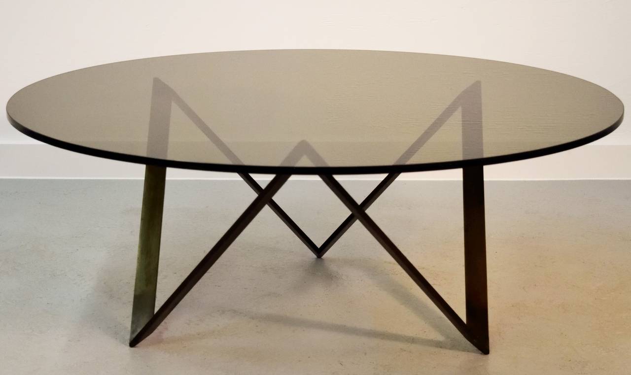 Geometric, heavy bronze base, with smoked glass top.