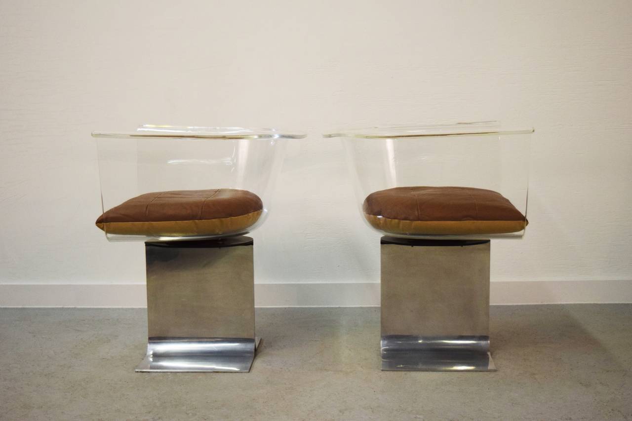 American Pair of Lucite Swivel Chairs with Steel Bases