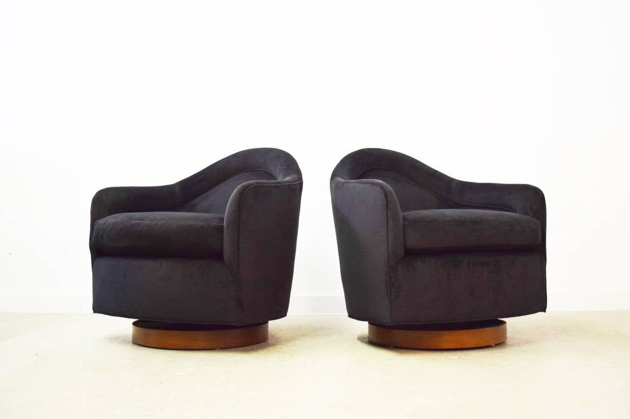 Pair of rock and swivel Milo Baughman chairs. Fully restored and reupholstered in black velvet.