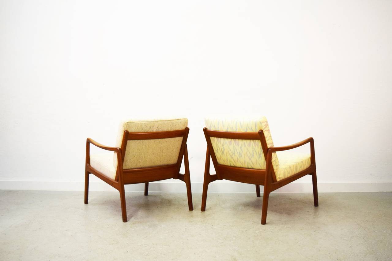 Pair of Ole Wanscher teak easy chairs.