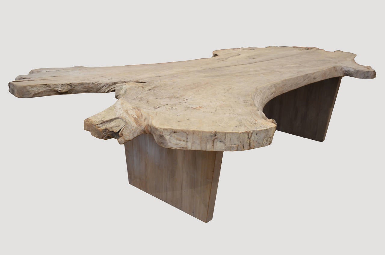 Originally one 6″ thick teak wood slab sliced in half with diverging ends for a stunning, dramatic effect. One of a kind table made from weathered teak. The organic teak is left in its natural weathered condition until it reaches this beautiful