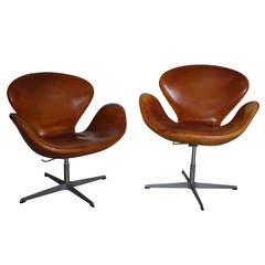 Arne Jacobsen Pair of Swan Chairs in Natural Leather