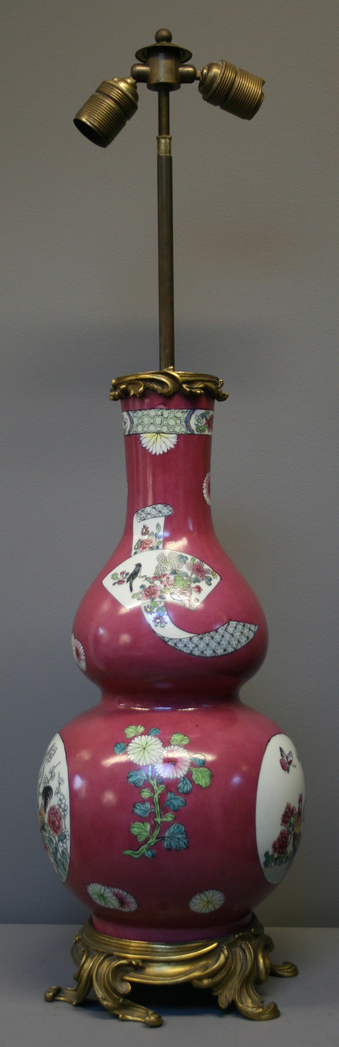 Chinese Export A Chinese style famille rose Samson gourd vase with ormolu lamp fittings