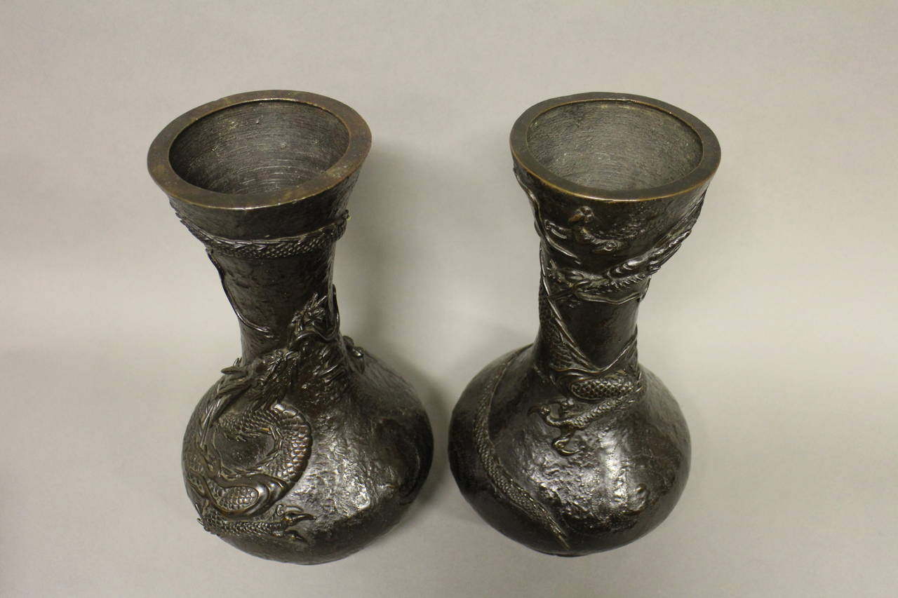 A pair of Japanese bronze vases decorated with dragons. Signed to base.

(Buyers in the UK and Europe will be subject to +VAT)