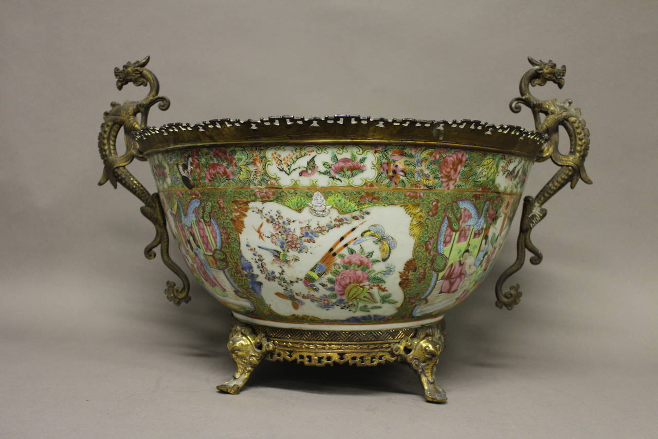 A Chinese Canton bowl in French bronze mounts, decorated with a floral design and panels of birds and scenes of everyday life.

We have many other Cantonese items, please send us a message if you are interested. 

(Buyers in the UK and Europe