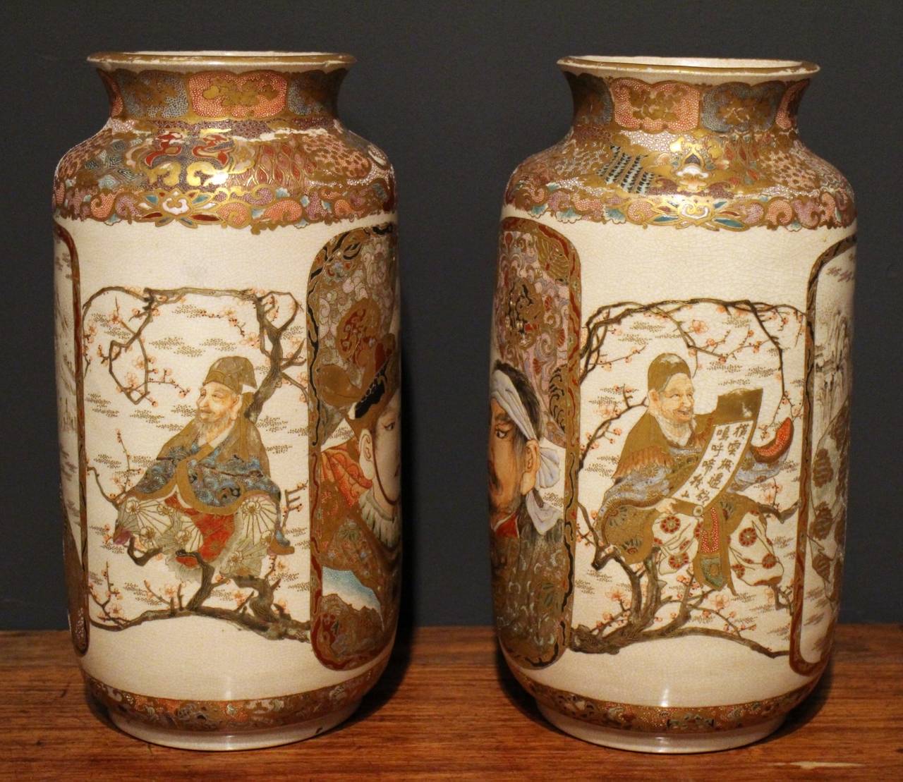 A pair of unusual Japanese Satsuma vases decorated with large portraits of Samurai warriors.


