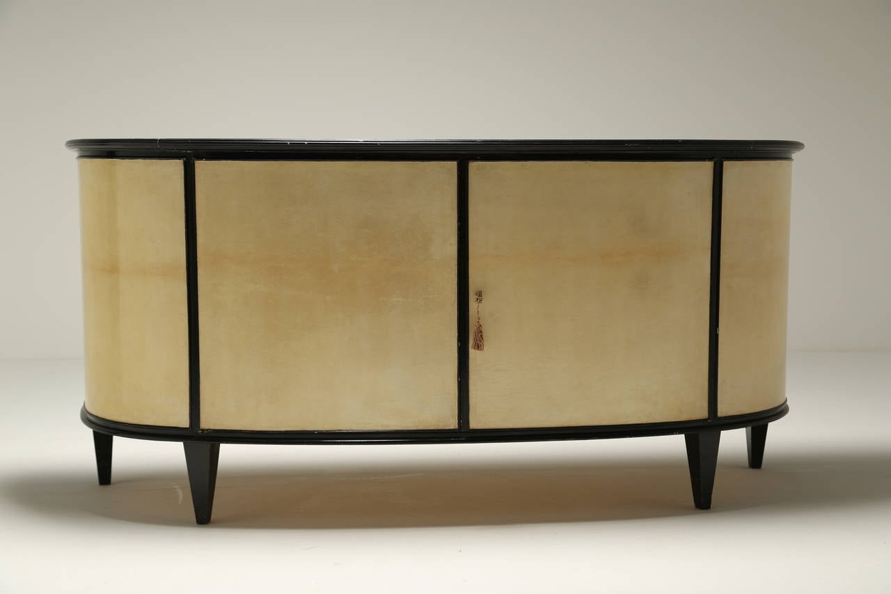 Mid-Century Modern An Italian Parchment Covered and Ebonised Demi-Lune Sideboard