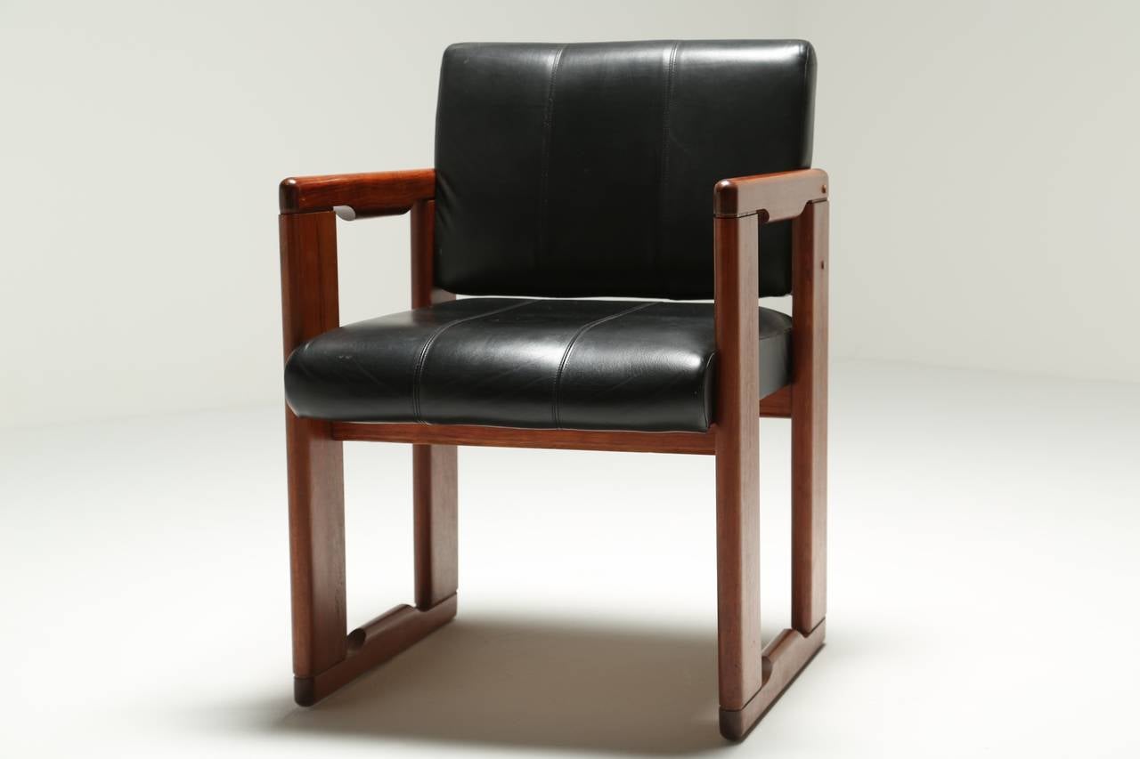 A black leather and wood Dialogo chair. I'm not sure of the exact timber used, it might be Ash. The chair is in excellent condition throughout. It would make an excellent home office chair or reading chair. Comfortable to sit in and robust, a