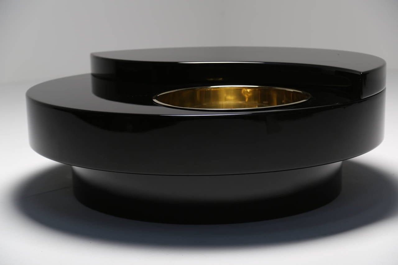 Late 20th Century Mario Sabot swivel black lacquer and brass coffee table.