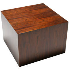 A Rosewood cube side table in the manner of Milo Baughman.