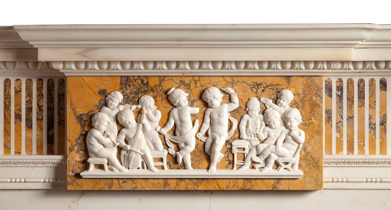 A very fine and perfectly proportioned Statuary and Sienna marble chimneypiece, from the late 18th century Adam period.

The chimneypiece has a beautifully carved and overlaid center tablet depicting the marriage of cupid and psyche. The frieze