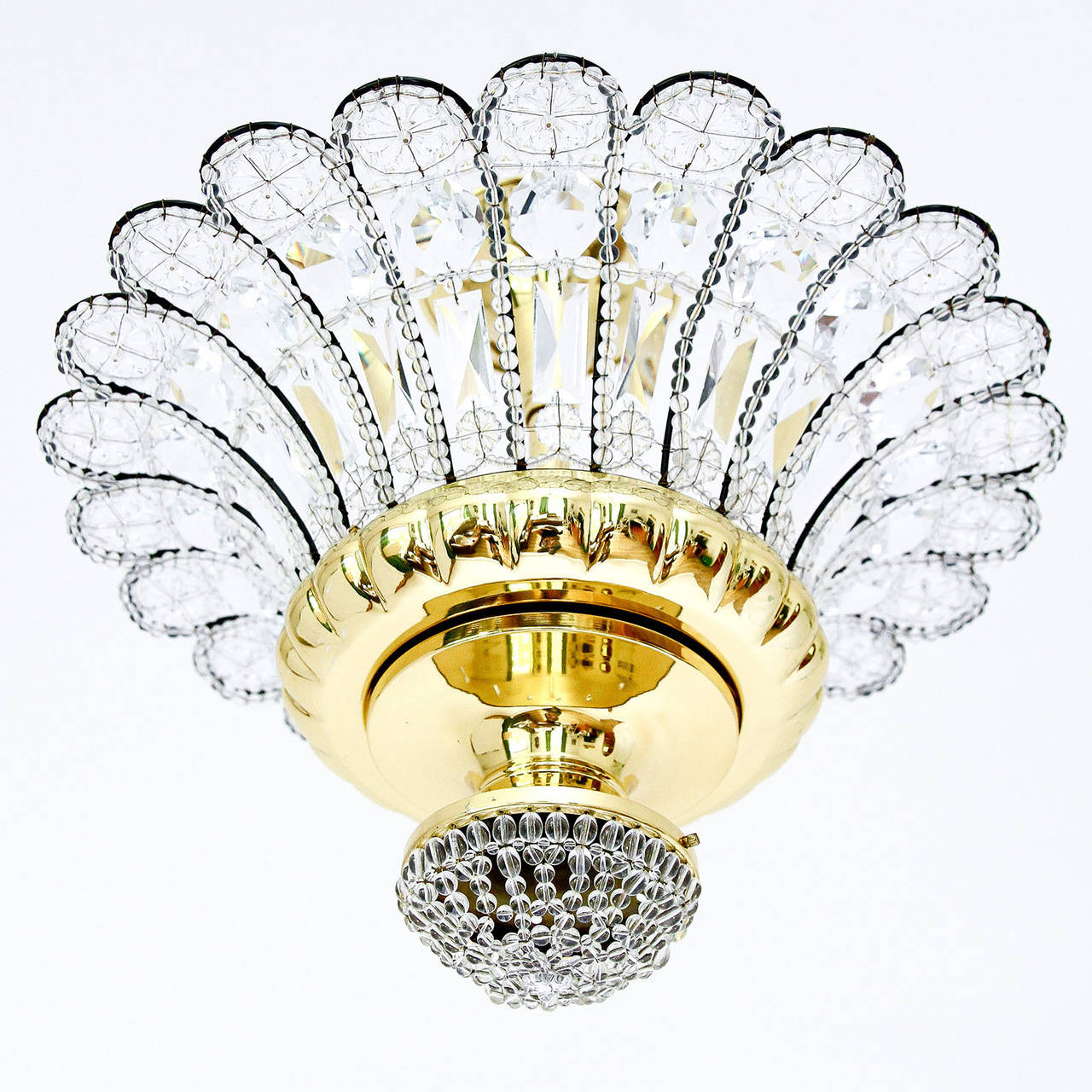 An impressive flush mount light fixture or chandelier by Banci Firenze, Italy. A brass and metal frame is decorated with many cut glass crystals in different shapes and sizes.
The light has seven sockets for medium base bulbs or LEDs.

The price is