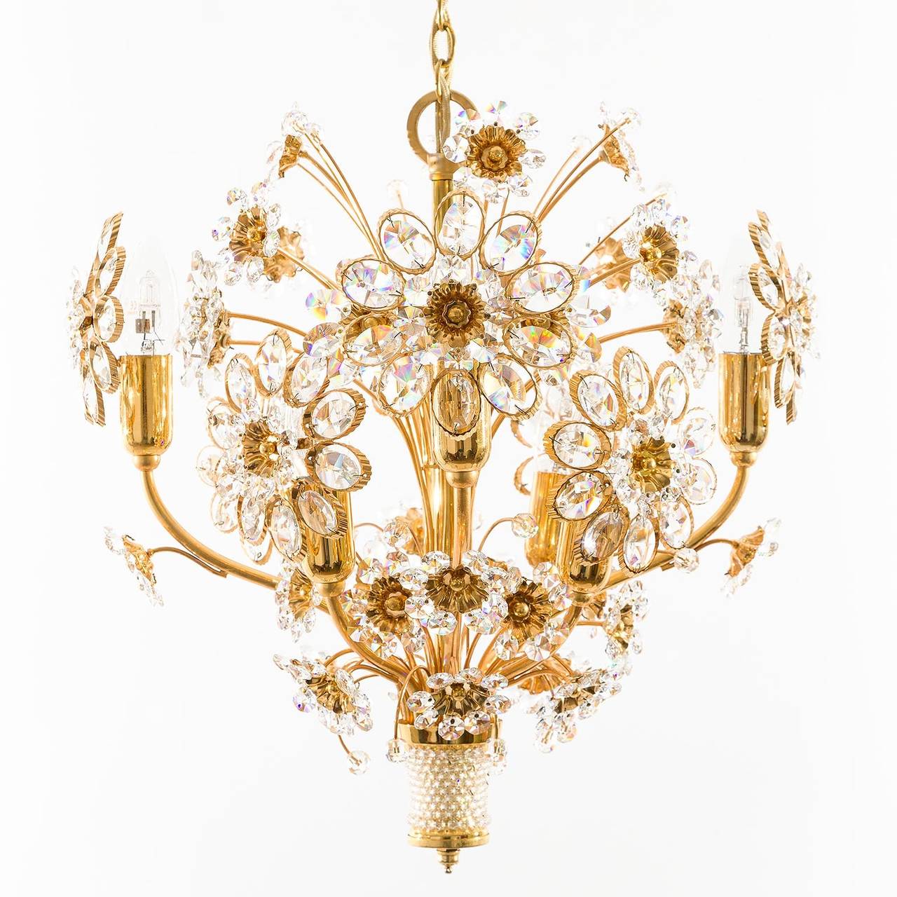 A beautiful and high quality hollywood regency chandelier or pendant light by Palwa (Palme & Walter), Germany, manufactured in Mid-Century, circa 1970 (late 1960s or early 1970s). It is made of an extensive manufactured gold plated brass frame