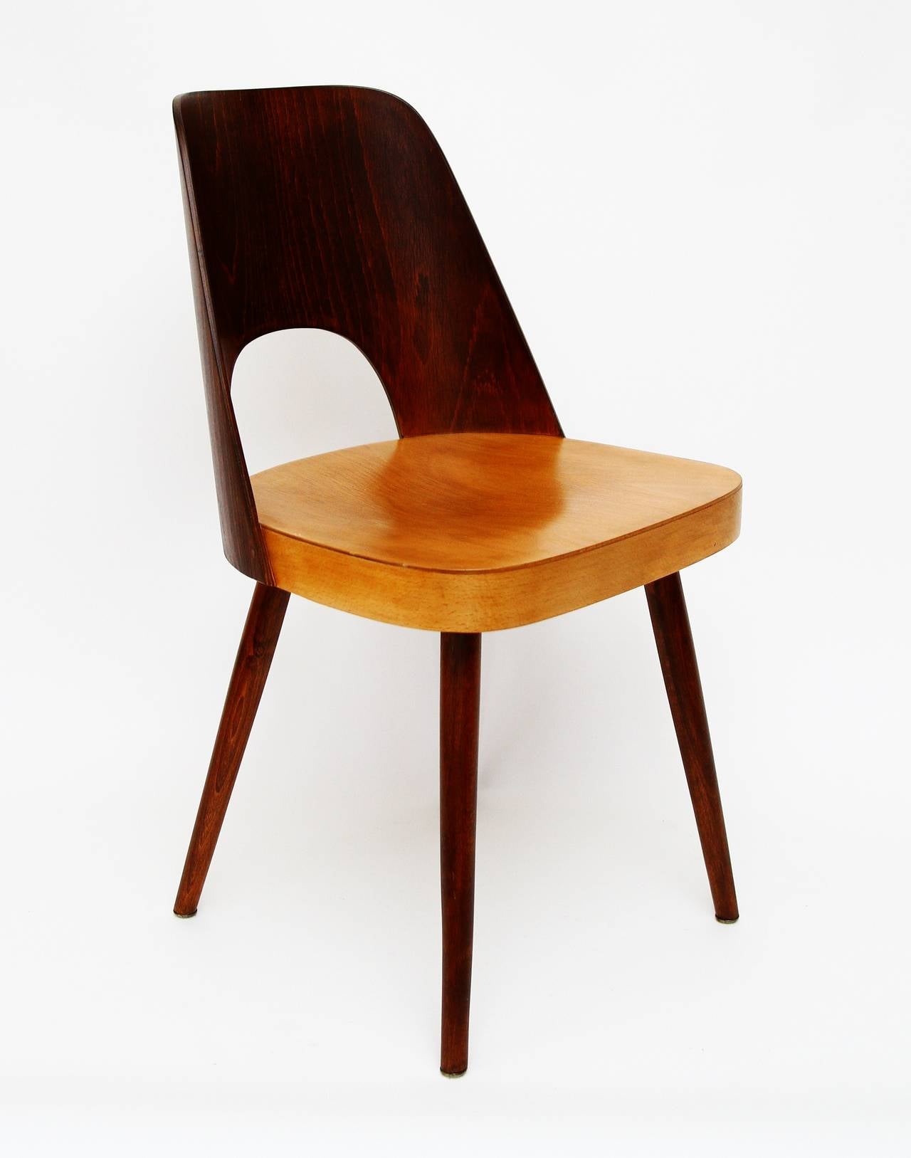 Very nice chair from Oswald Haerdtl for Thonet. This bicolored (brown and natural beech) chair is absolute classic. Carefully restored, excellent condition.