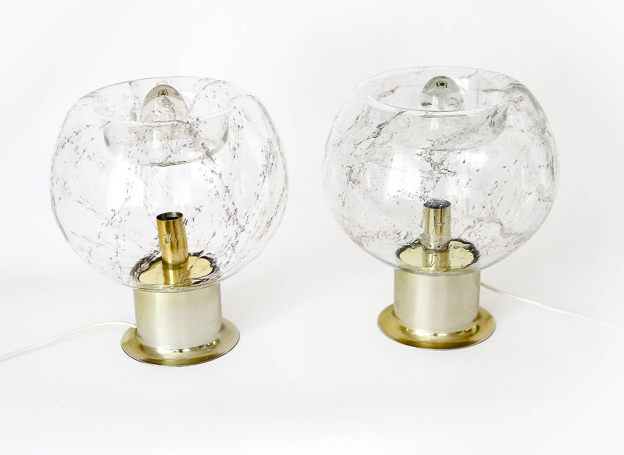 A large hand blown glass table lamp by Doria, Germany, manufactured in Mid-Century, circa 1970. Smoked glass globes with a lot of bubble air inclusions which produce a very charming light. The stand is made of metal in brass finish.
Only one piece