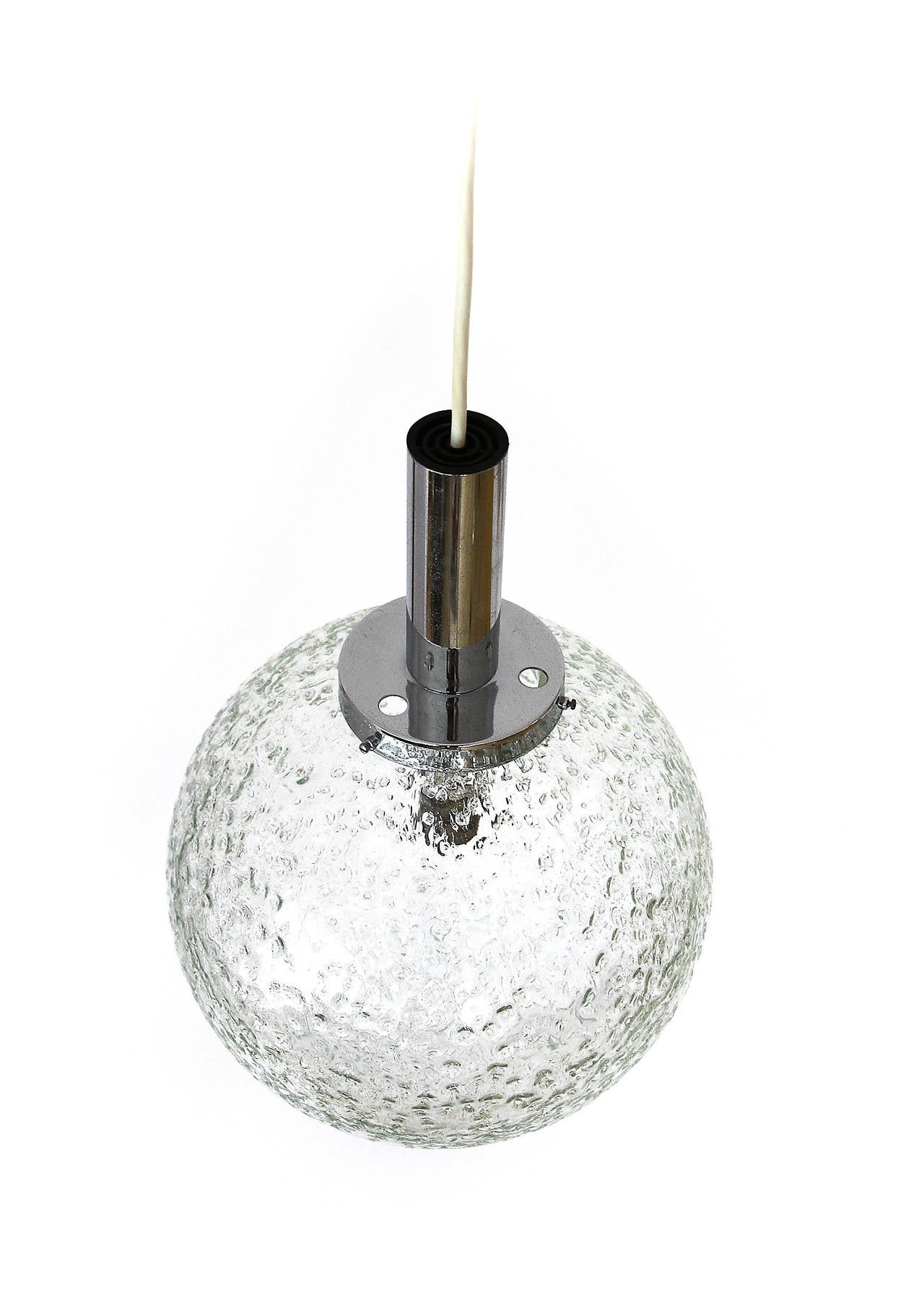 A globe pendant light / hanging lamp by Doria, Germany, manufactured in Mid-Century, circa 1970. This light fixture is made of chrome (nickel) and a hand blown textured glass globe.
The total drop can be altered to any length for free of charge.