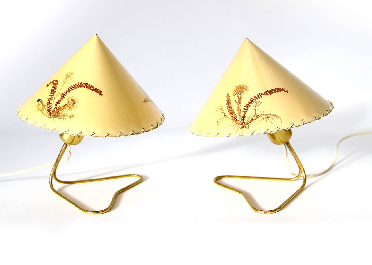 Charming pair of Viennese table or wall lamps by Rupert Nikoll Vienna, Austria, from the 1950s. These lights can be used as table lamps or can be hang-up on a wall. The lampshades are very special: there are dried Austrian flowers on paper and