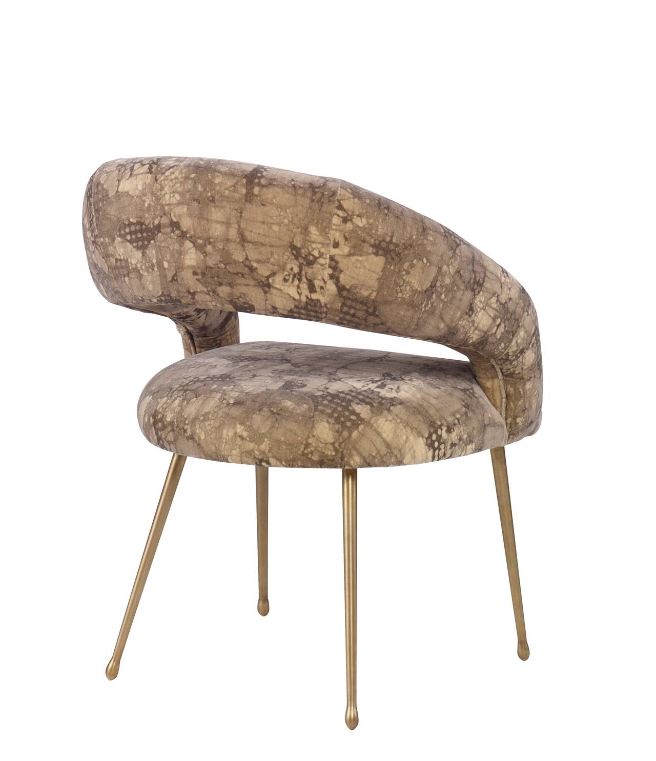 Inspired by Kelly Wearstler’s signature soufflé chair shape, the Laurel Chair features a dramatic swooping, curved back, tight upholstered seat, and exposed back. It rests on on cast brass legs in burnished bronze with an elegant, teardrop foot.