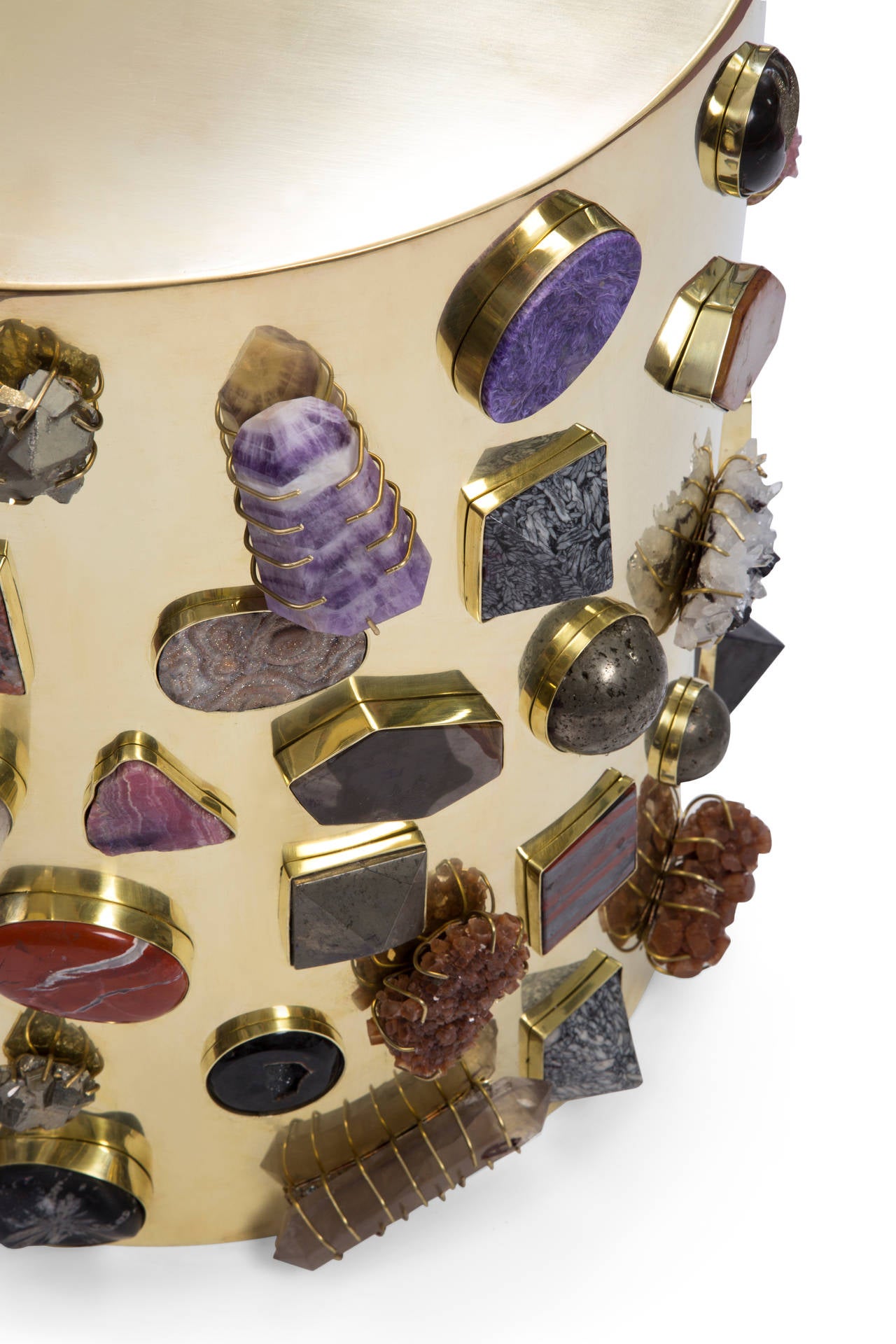 The Bejeweled Stool is available in natural bronze, which will develop a rich antique luster over time. Each stool features a completely unique collection of semi-precious stones; no two are completely alike.  Stones include a mixture of lapis,
