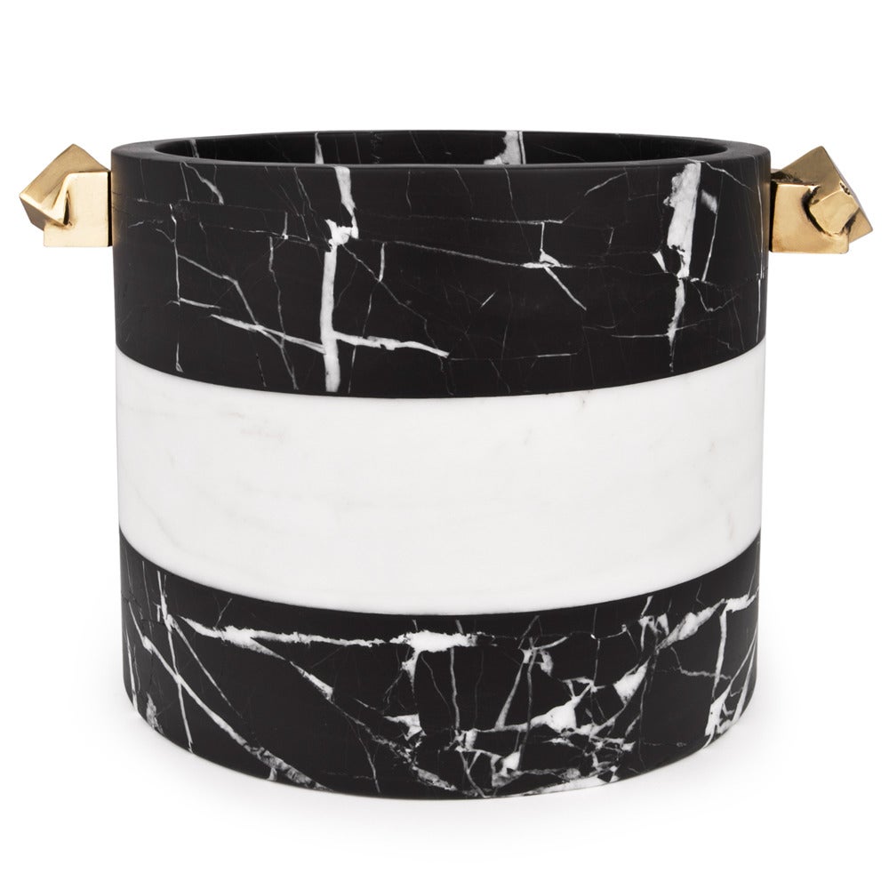 Featuring a stunning Acolyte Ice Pail adorned with natural bronze handles cast from hand-picked pyrite stone. Kelly Wearstler’s love of entertaining essentials inspired this contrasting black and white ice bucket hand-sculpted from negro marquina