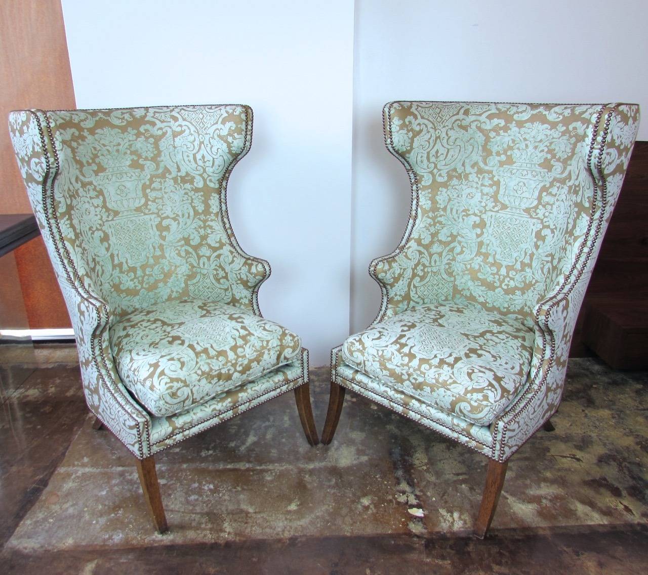 Pair of Dennis & Leen Highback English Wing chairs with double row nailhead trim and Andre du Dauphine upholstery.