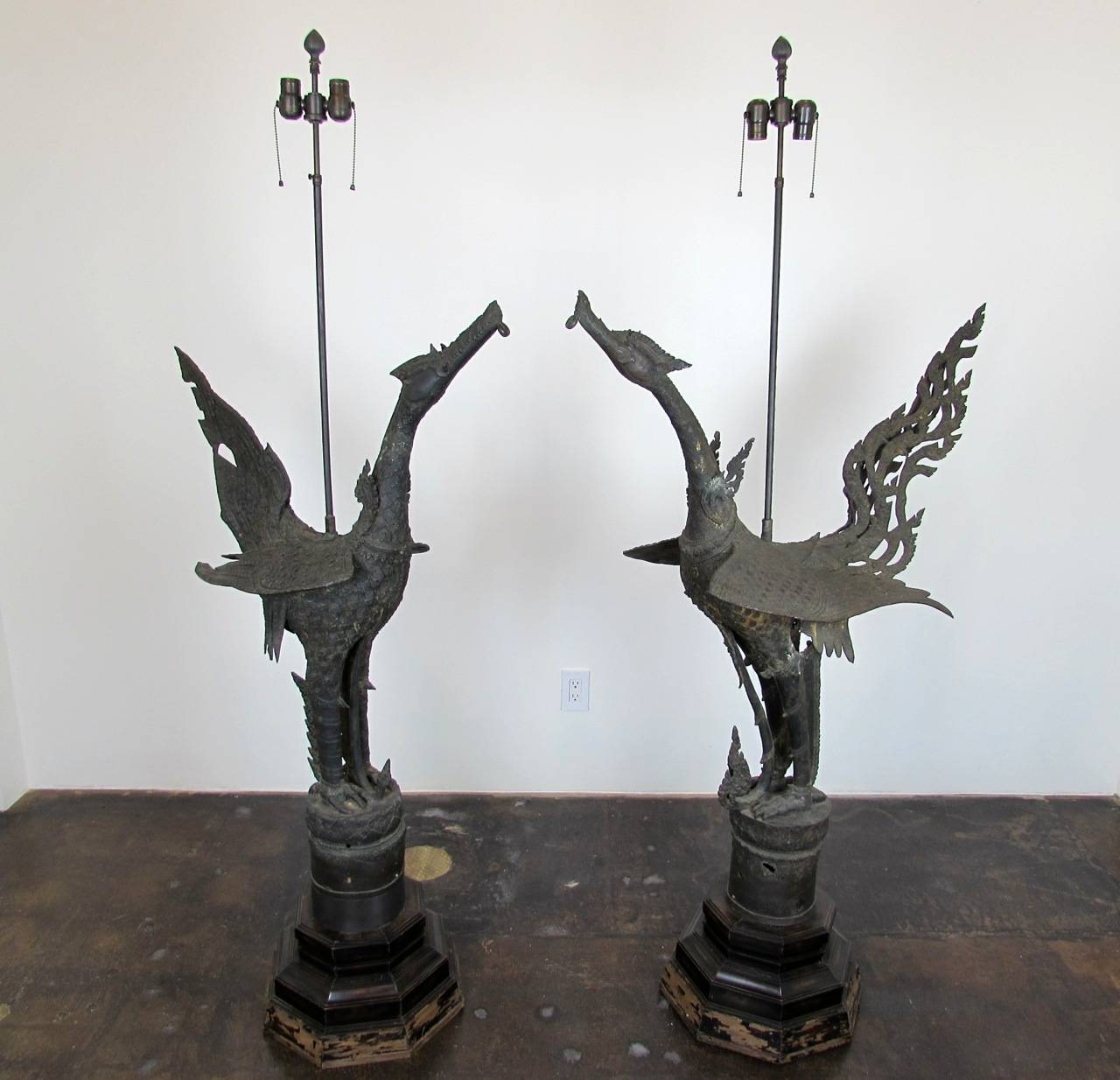 Pair of 19th Century Thai hand cast bronze Hong or Hongsa sculptures converted into floor lamps on wooden bases. Sold as a pair, but are not identical. Larger Hong is approximately 36