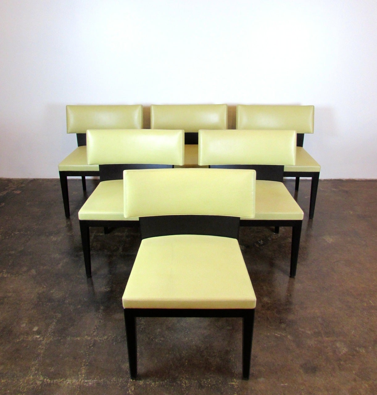 Set of six Christian Liaigre for Holly Hunt solid mahogany chairs with light celadon Great Plains leather seats and backs. Overall, excellent condition with very minor wear to seat and back leather corners.